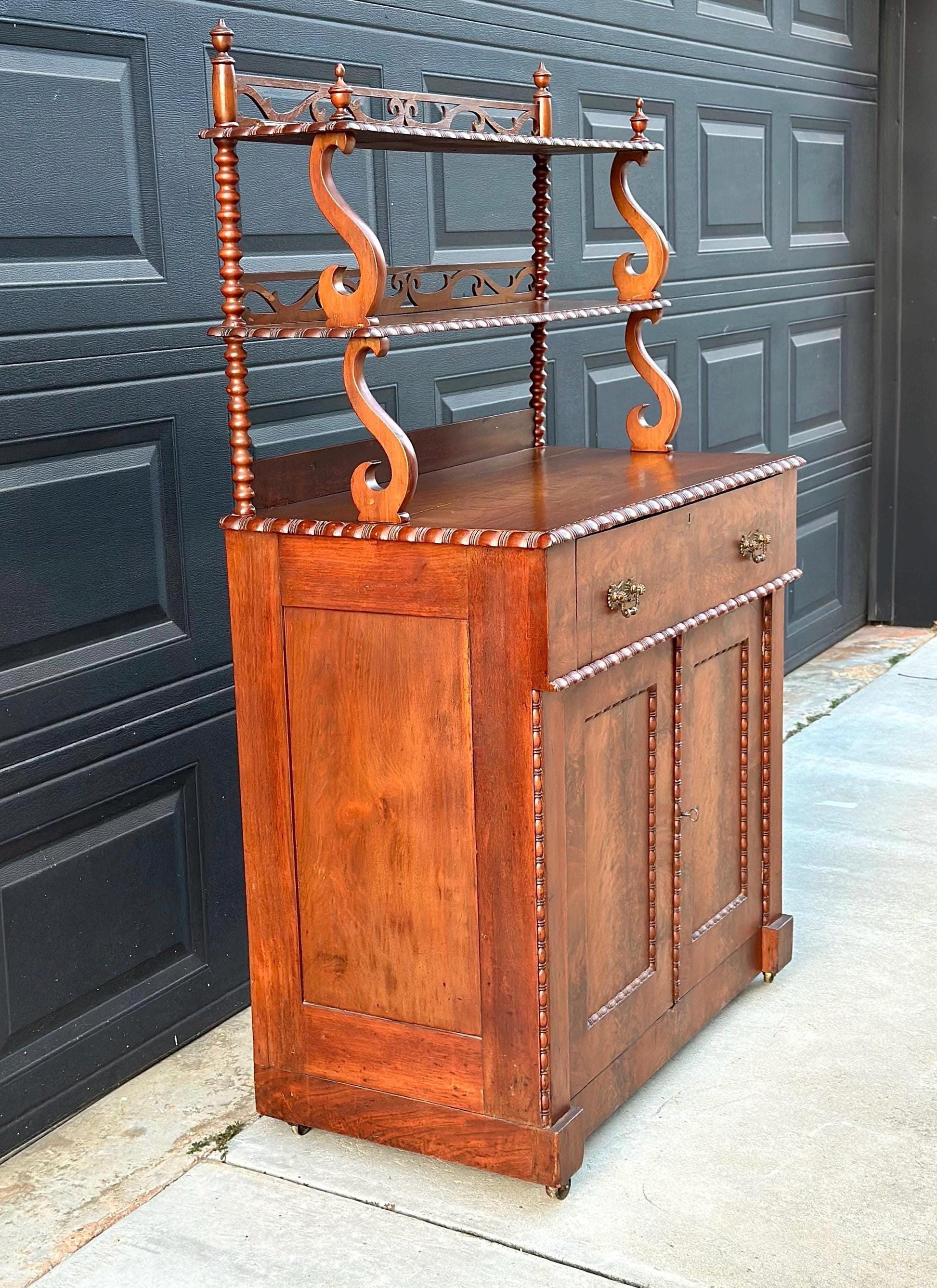 Antique Mid 1800's Victorian Flame Mahogany Wood Chiffonier Cabinet with Bobbin Bookshelf on Casters