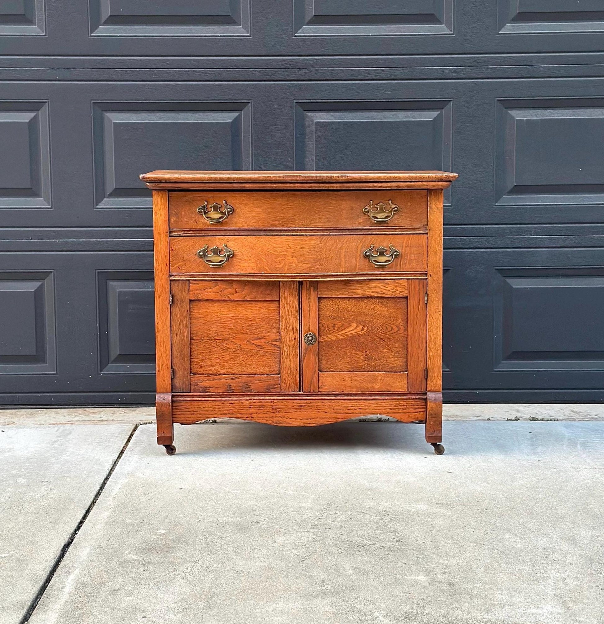 Antique Early 1900's Solid Wood Tiger Oak Curved Front Accent Cabinet on Casters