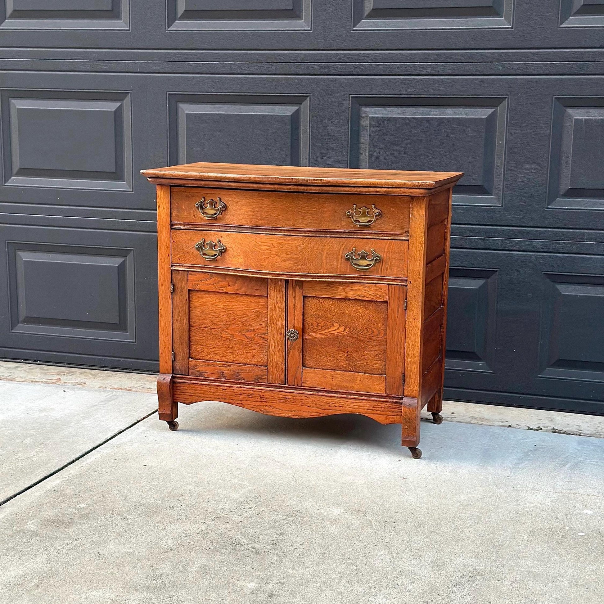 Antique Early 1900's Solid Wood Tiger Oak Curved Front Accent Cabinet on Casters