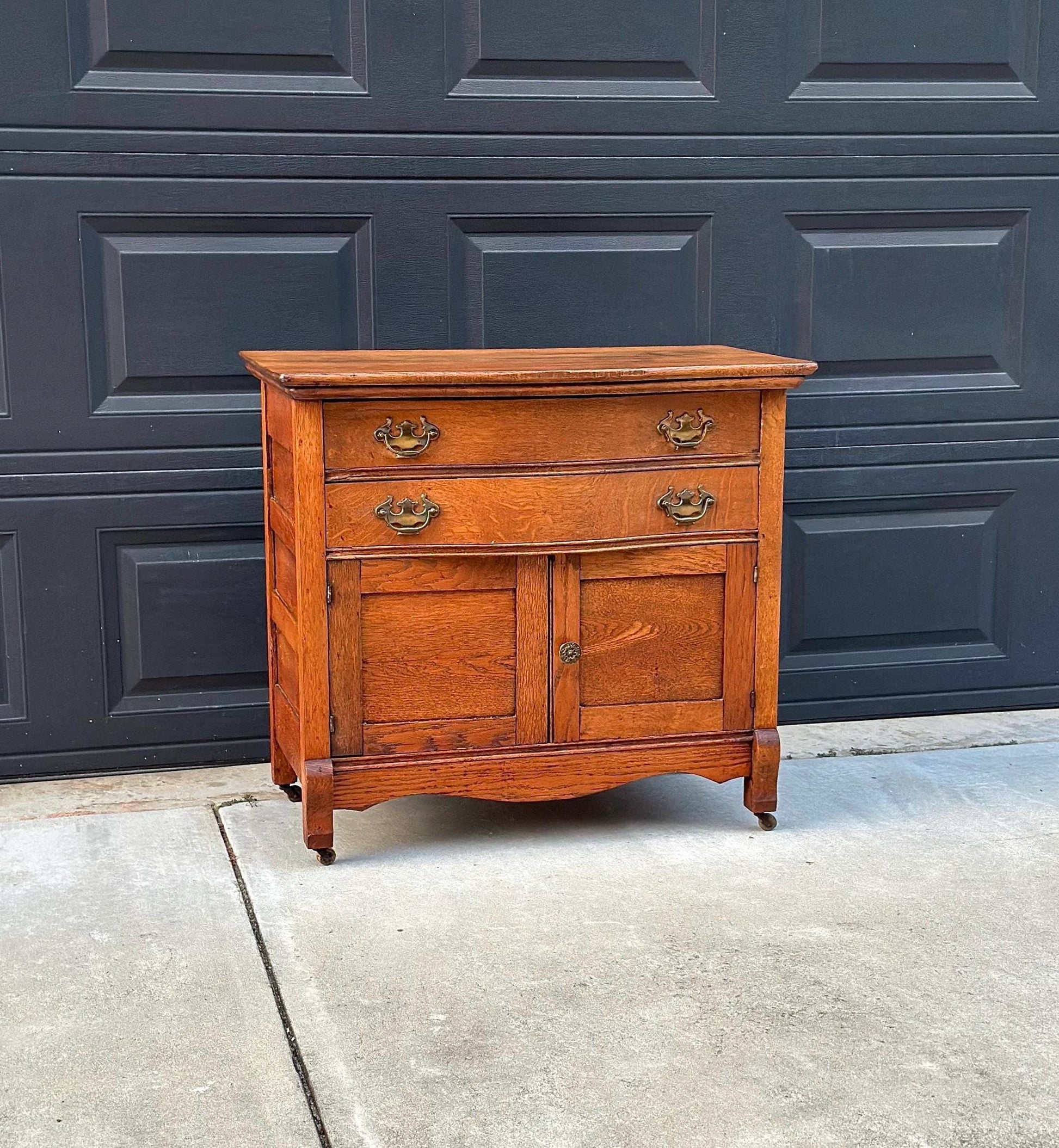 Antique Early 1900's Solid Wood Tiger Oak Curved Front Accent Cabinet on Casters