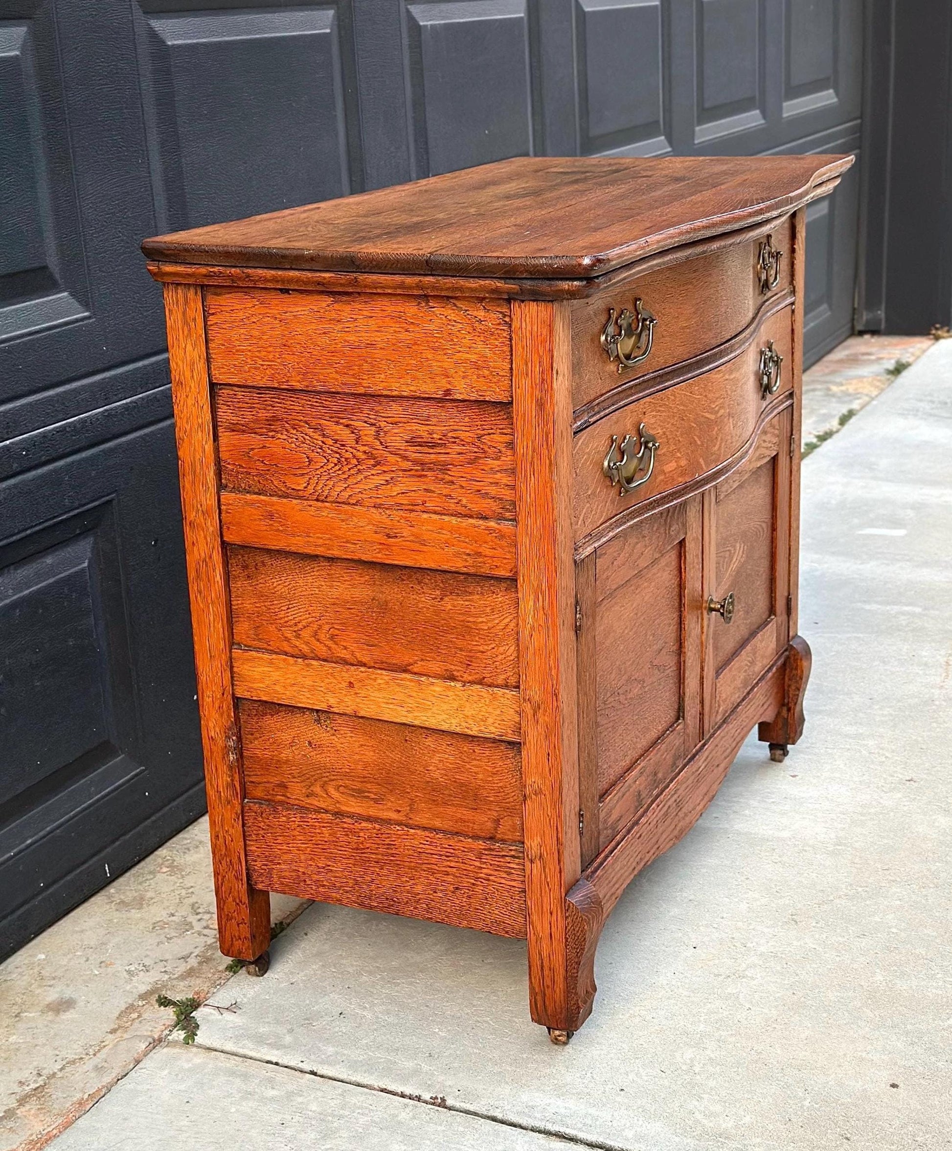 Antique Early 1900's Solid Wood Tiger Oak Curved Front Accent Cabinet on Casters