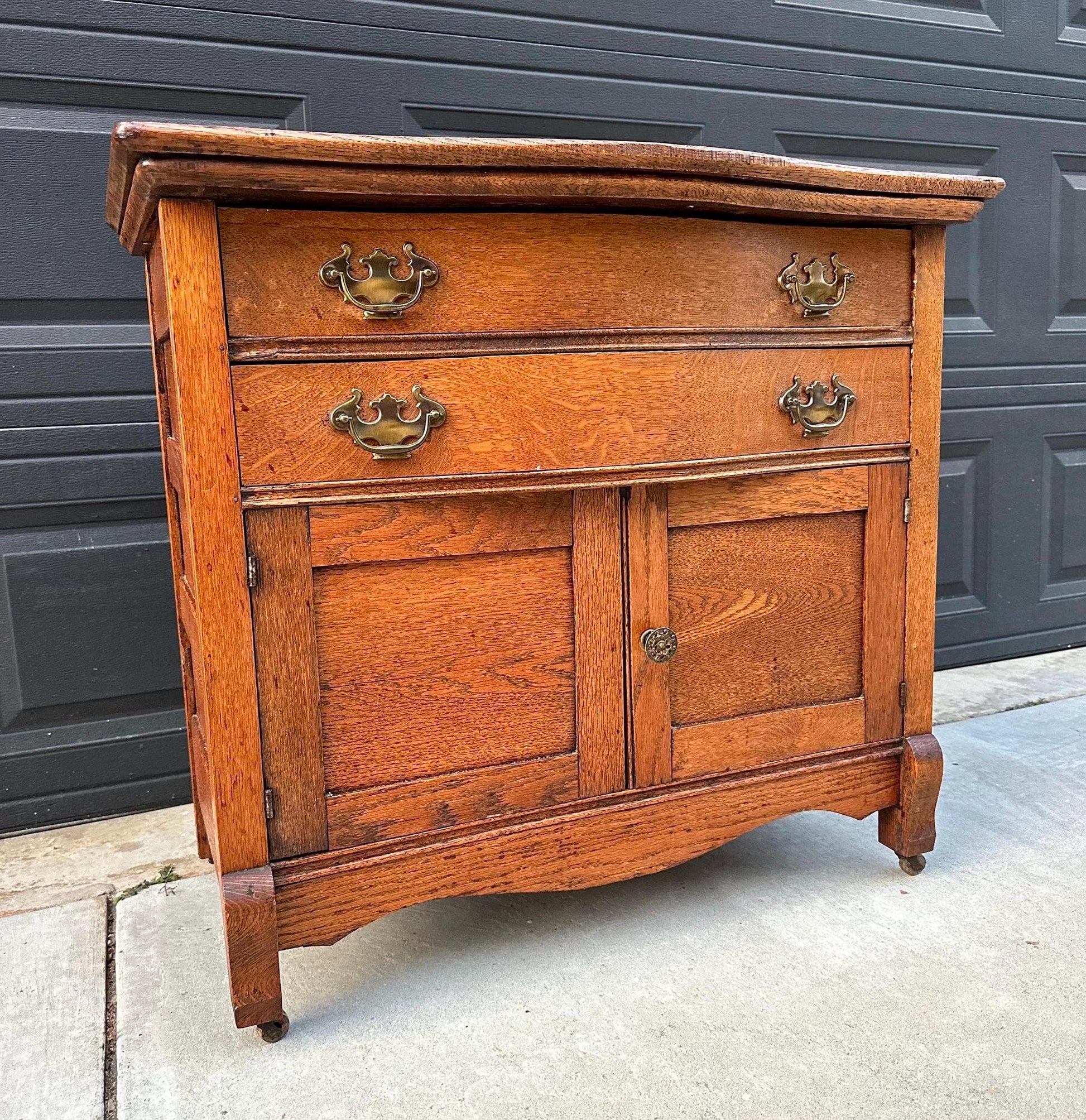 Antique Early 1900's Solid Wood Tiger Oak Curved Front Accent Cabinet on Casters