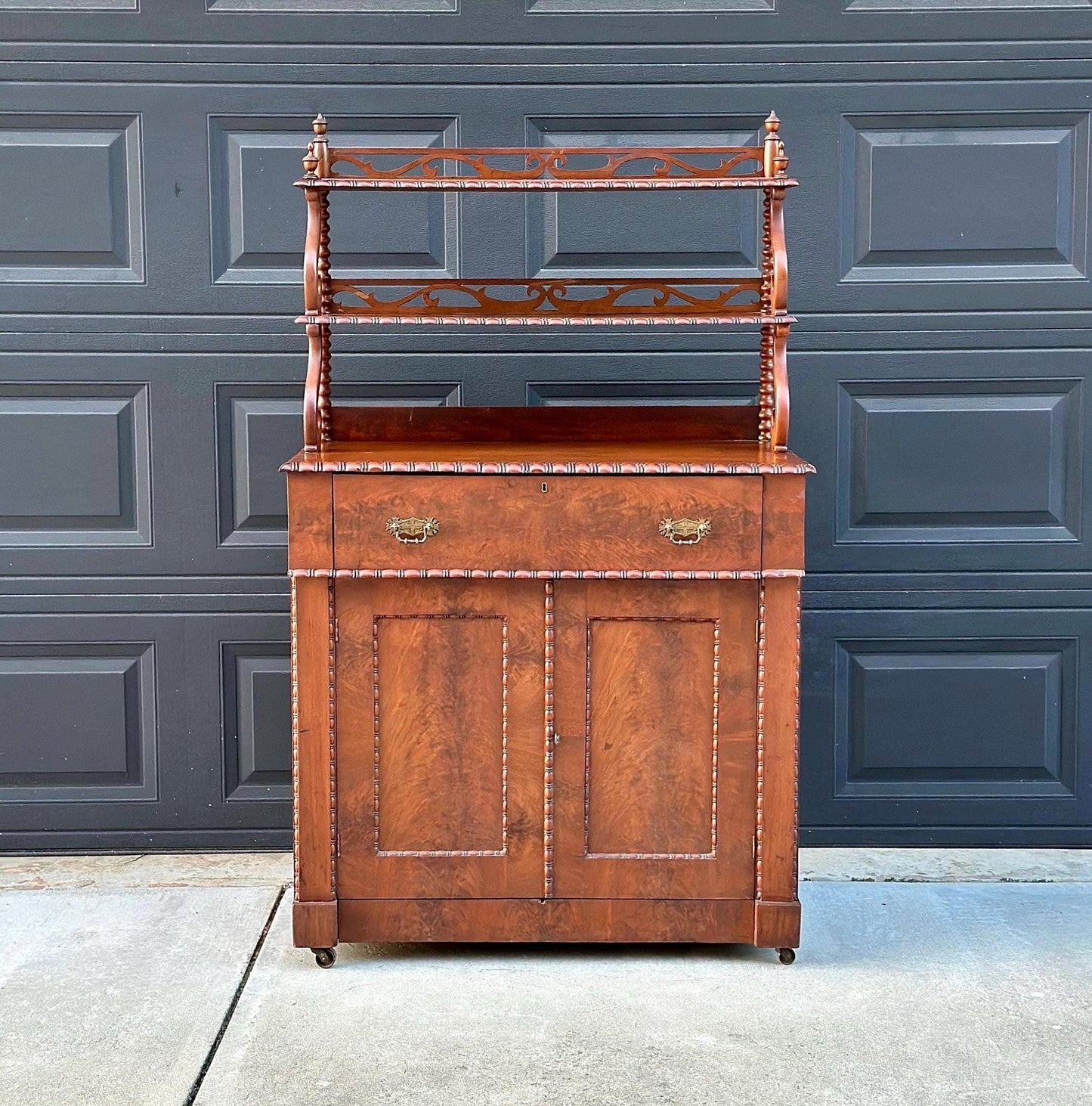 Antique Mid 1800's Victorian Flame Mahogany Wood Chiffonier Cabinet with Bobbin Bookshelf on Casters
