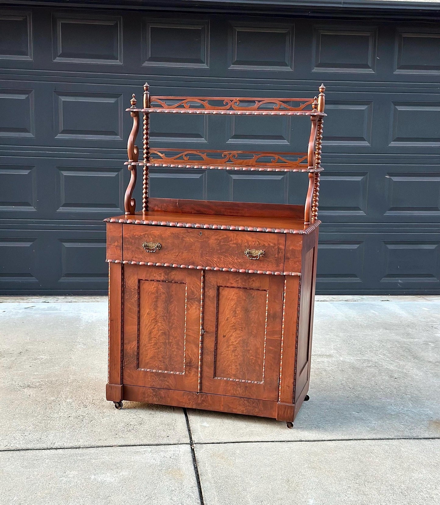 Antique Mid 1800's Victorian Flame Mahogany Wood Chiffonier Cabinet with Bobbin Bookshelf on Casters