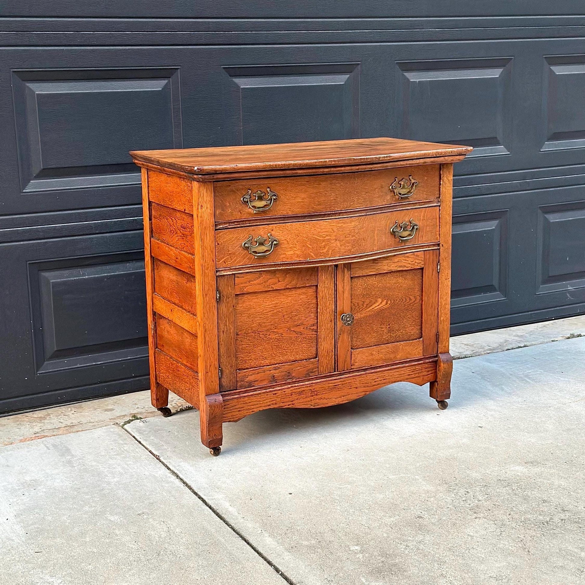 Antique Early 1900's Solid Wood Tiger Oak Curved Front Accent Cabinet on Casters
