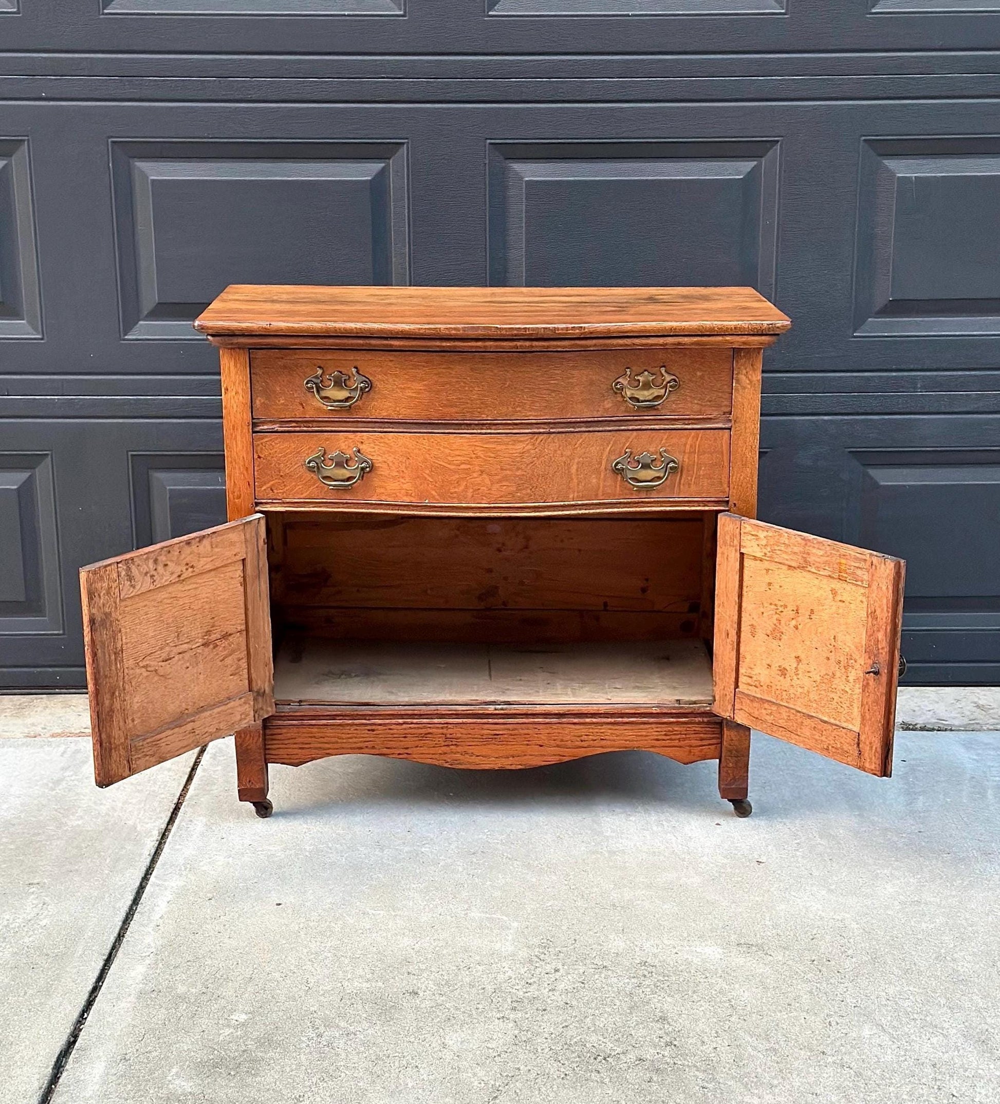 Antique Early 1900's Solid Wood Tiger Oak Curved Front Accent Cabinet on Casters