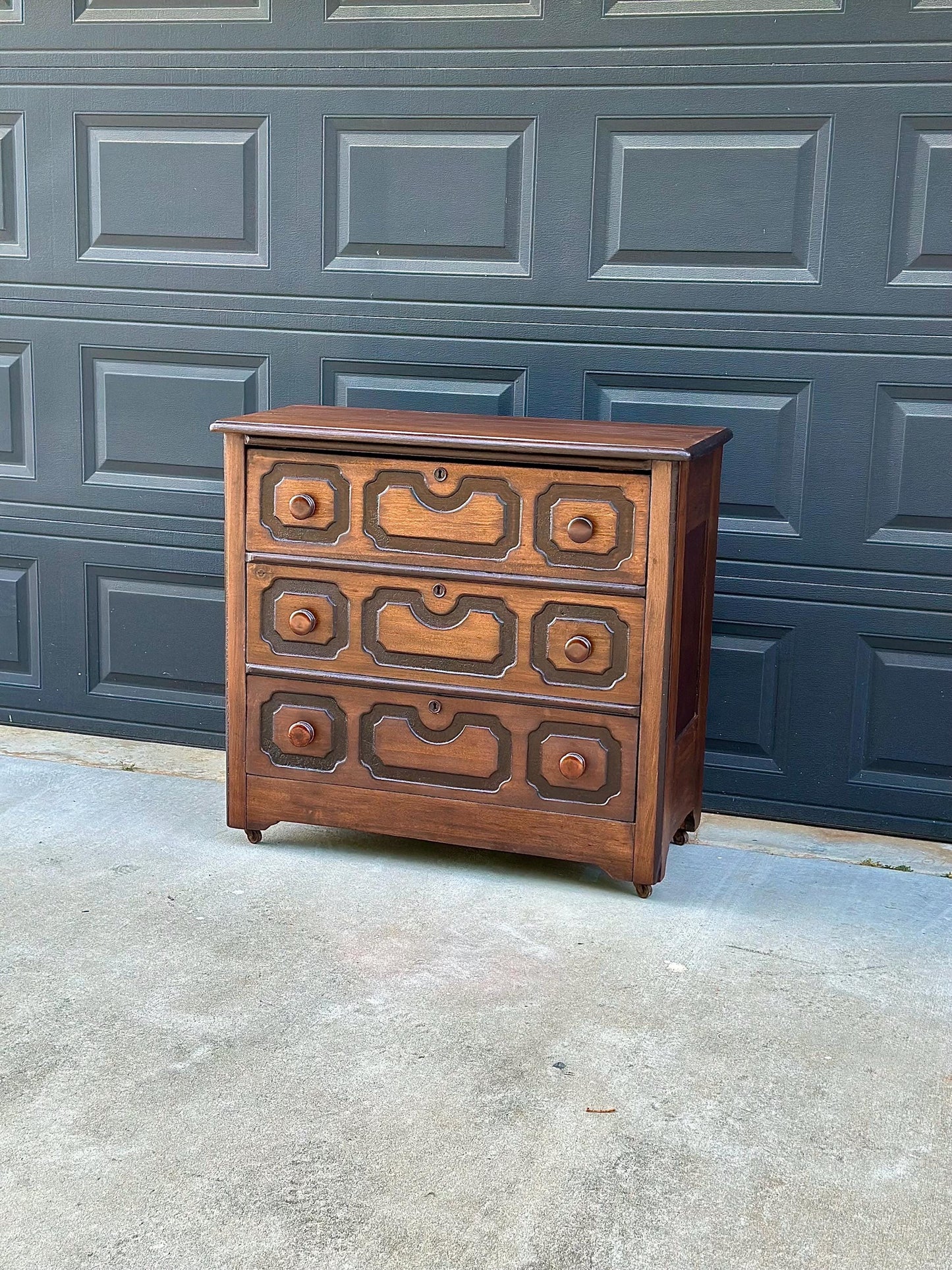 Vintage Late 19th Century Solid Wood Carved Walnut Rustic Storage Dresser on Casters