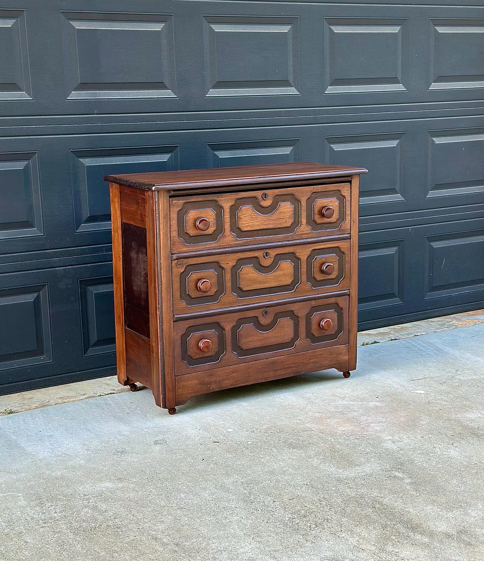 Vintage Late 19th Century Solid Wood Carved Walnut Rustic Storage Dresser on Casters