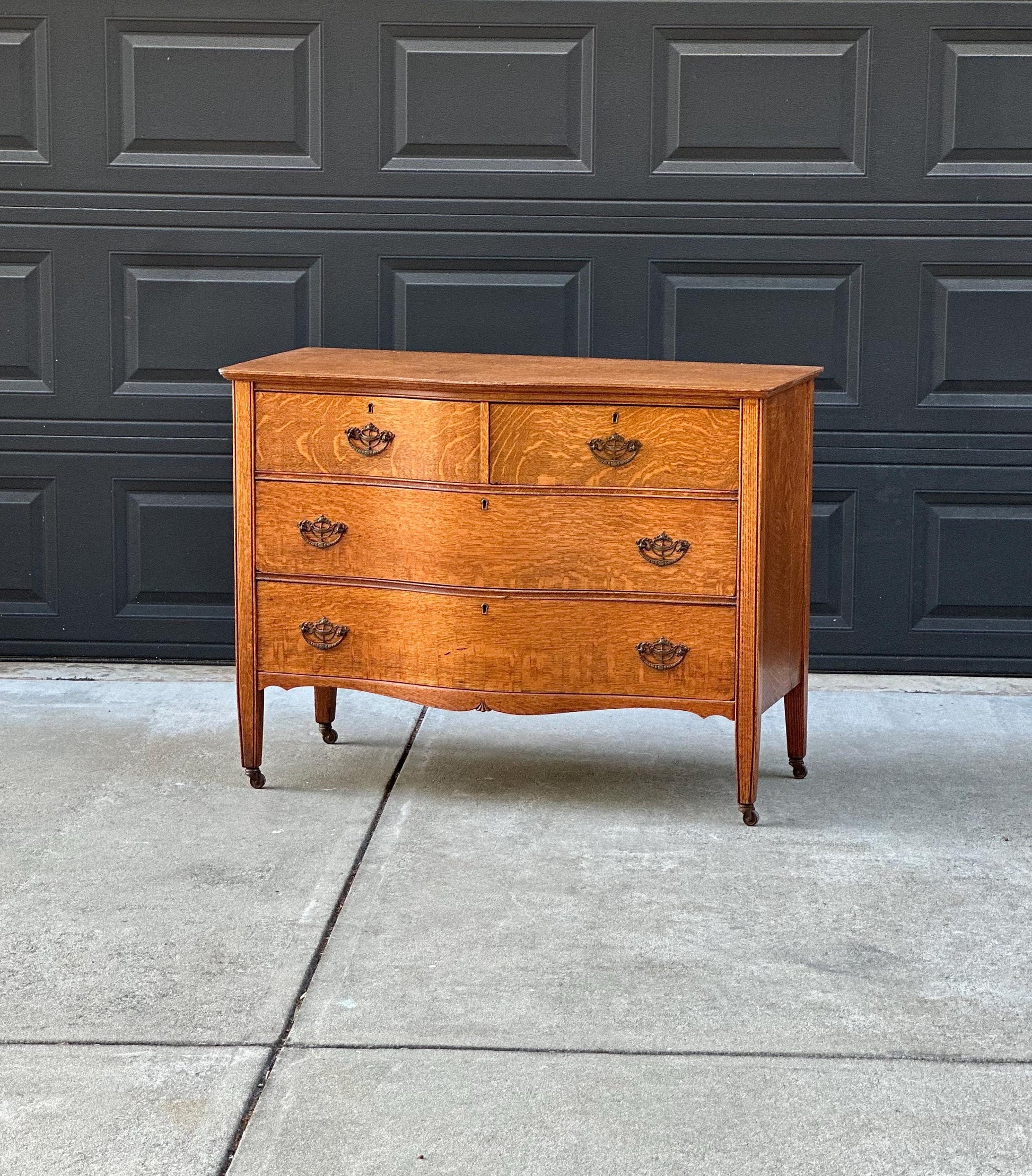 Antique Late 19th C Quarter Sawn Oak Curved Front Four Drawer Chest on Casters