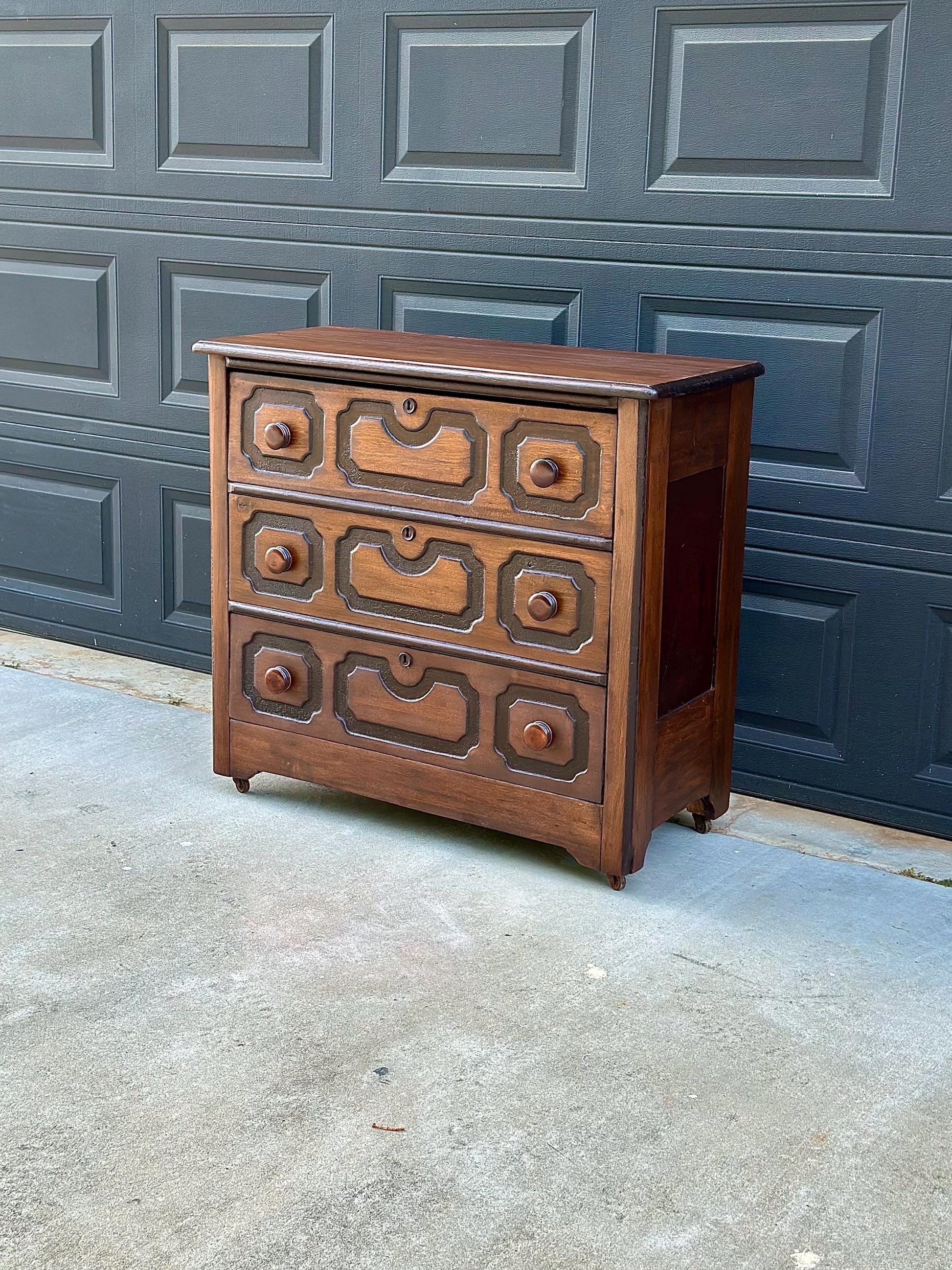 Vintage Late 19th Century Solid Wood Carved Walnut Rustic Storage Dresser on Casters