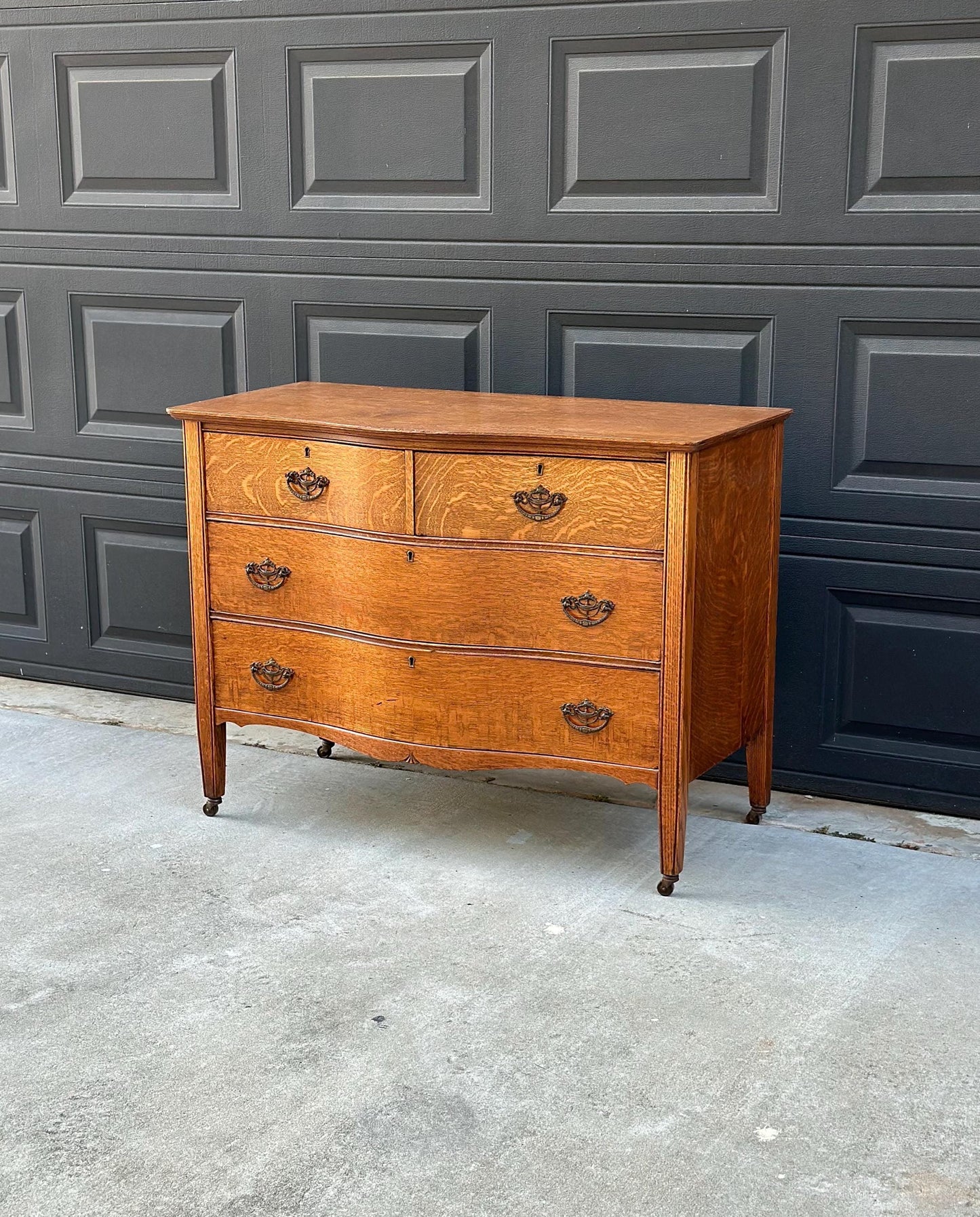 Antique Late 19th C Quarter Sawn Oak Curved Front Four Drawer Chest on Casters