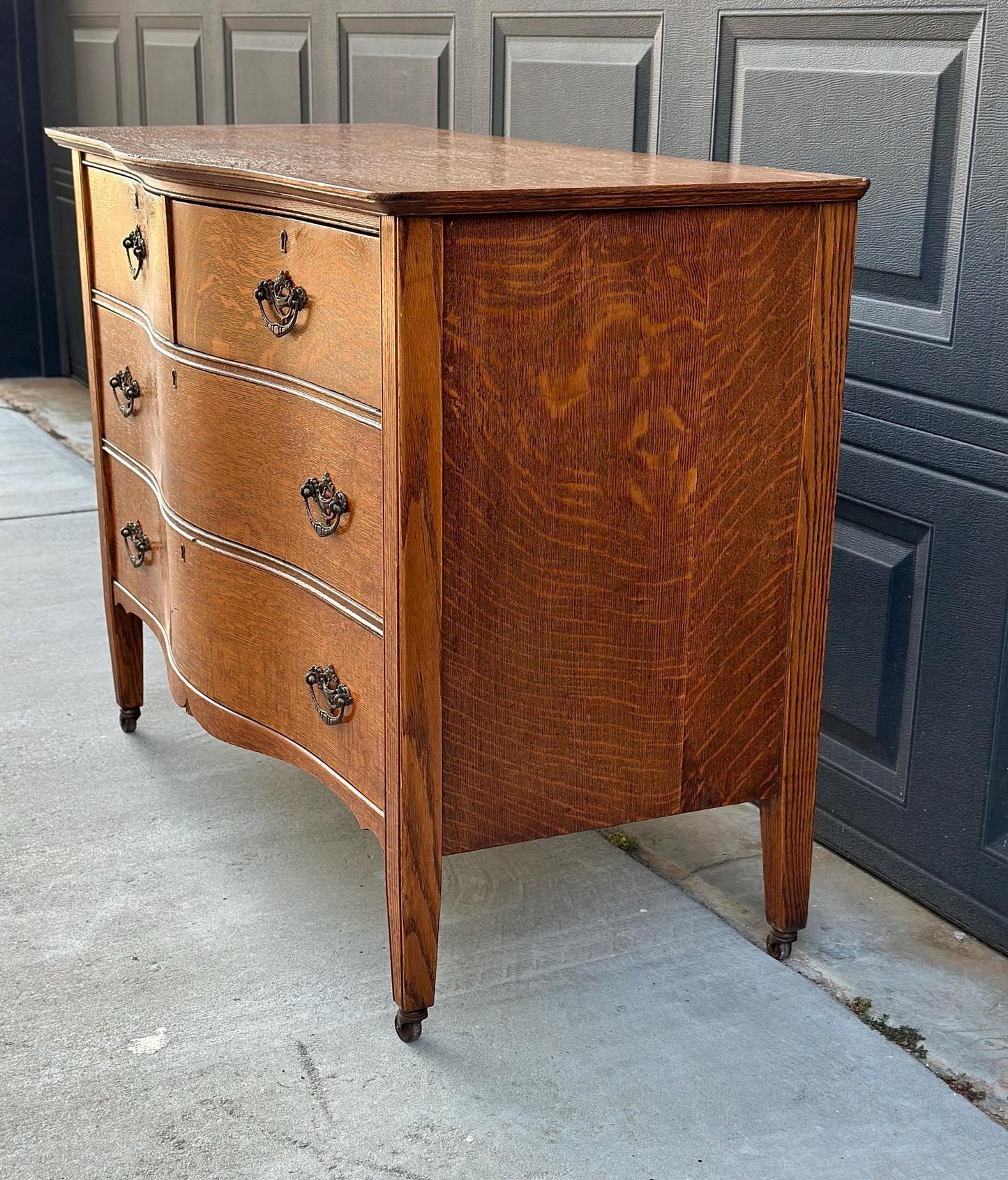 Antique Late 19th C Quarter Sawn Oak Curved Front Four Drawer Chest on Casters