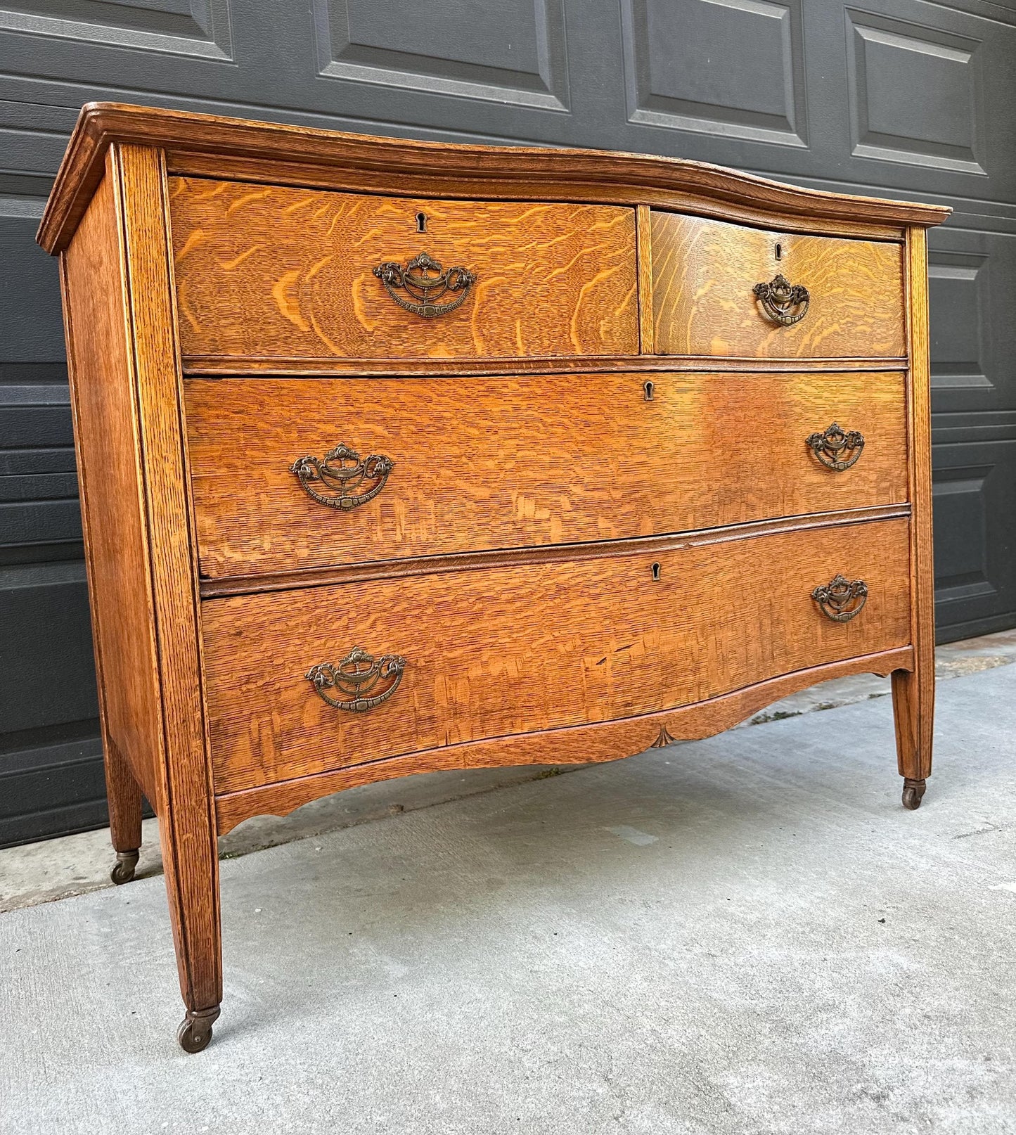 Antique Late 19th C Quarter Sawn Oak Curved Front Four Drawer Chest on Casters