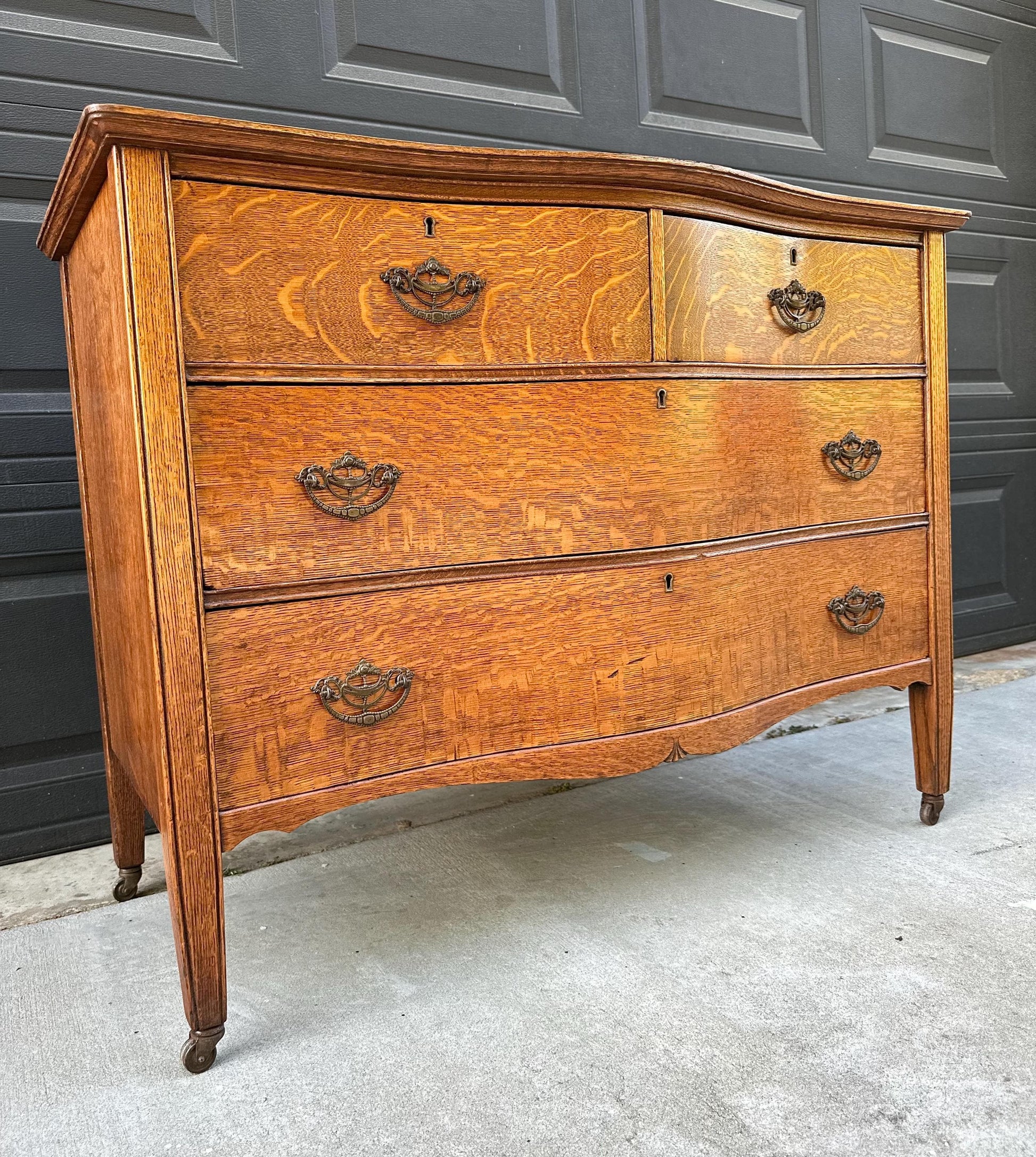 Antique Late 19th C Quarter Sawn Oak Curved Front Four Drawer Chest on Casters