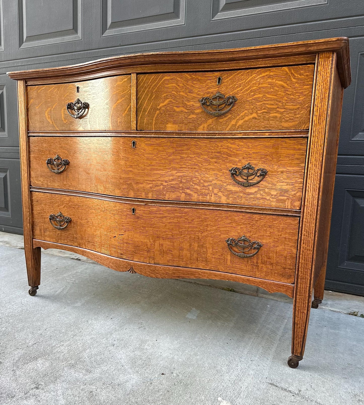 Antique Late 19th C Quarter Sawn Oak Curved Front Four Drawer Chest on Casters