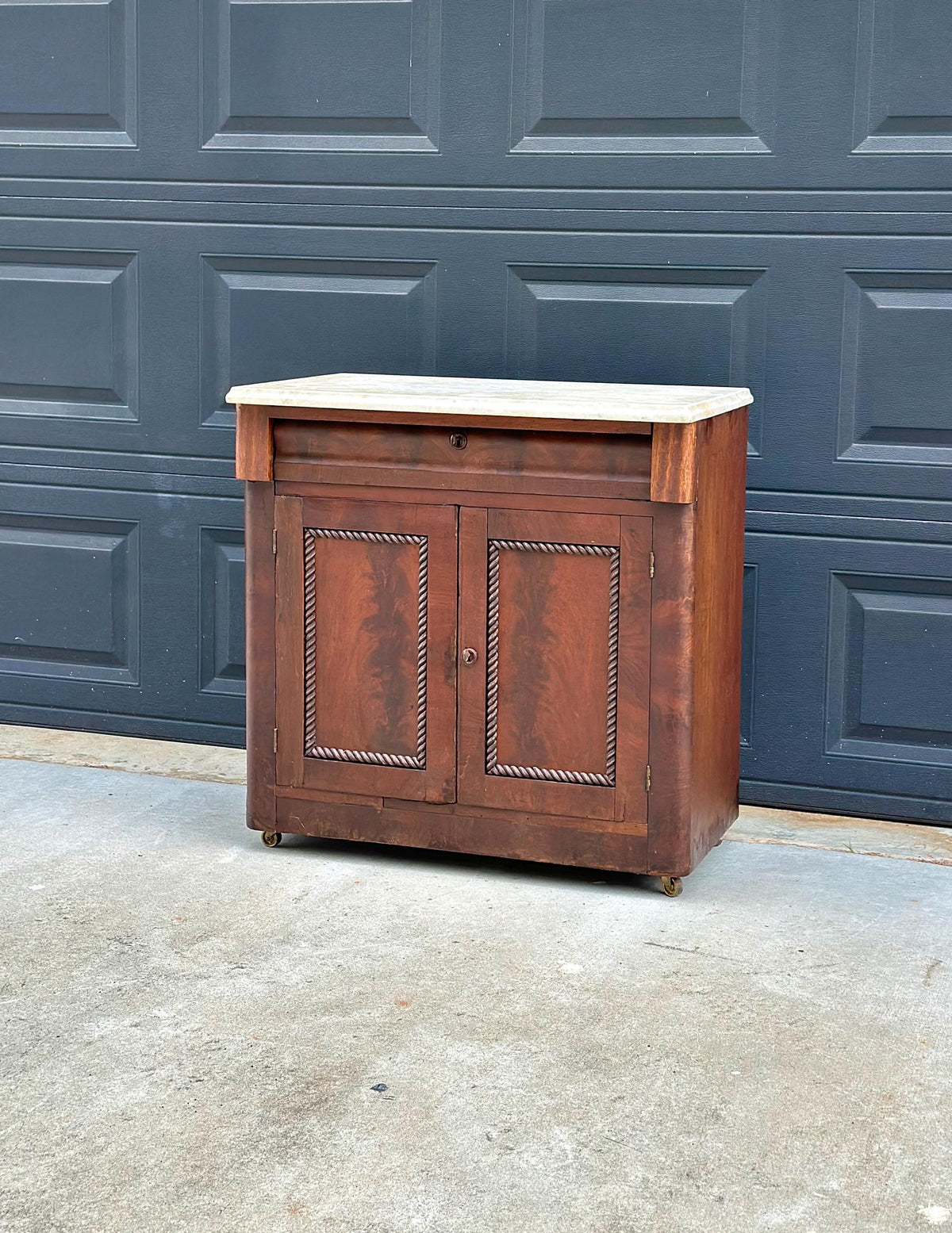 Antique Mid-19th C Marble Top Flame Mahogany Cabinet on Brass Casters (30" Wide)