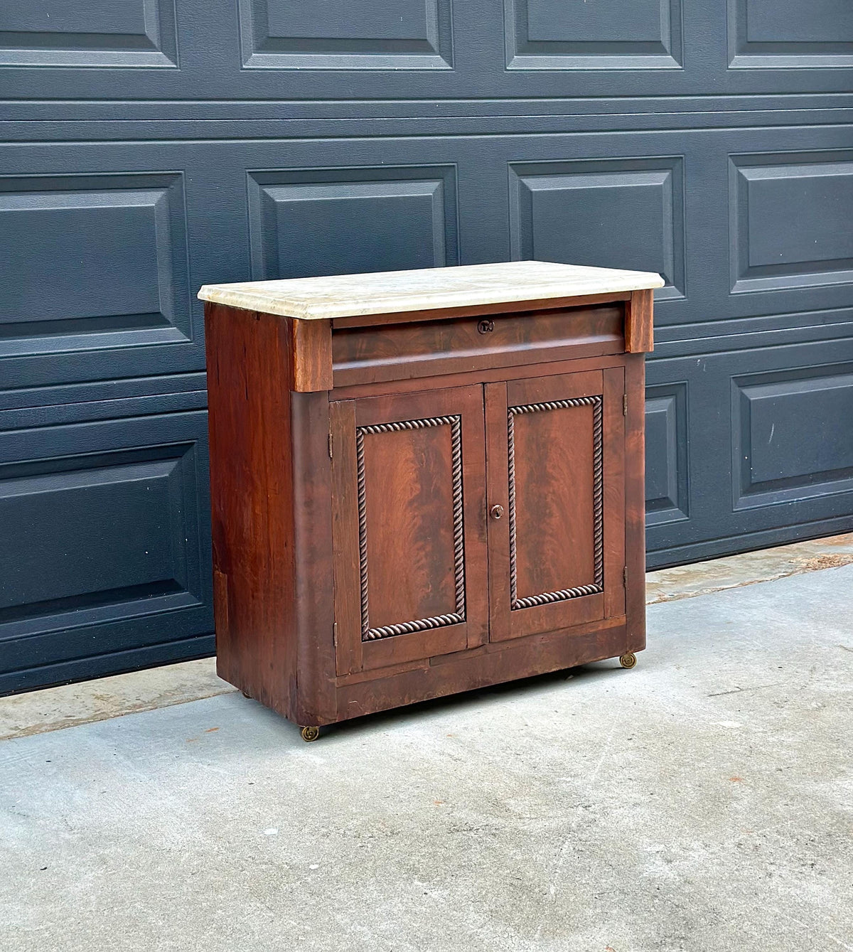Antique Mid-19th C Marble Top Flame Mahogany Cabinet on Brass Casters (30" Wide)