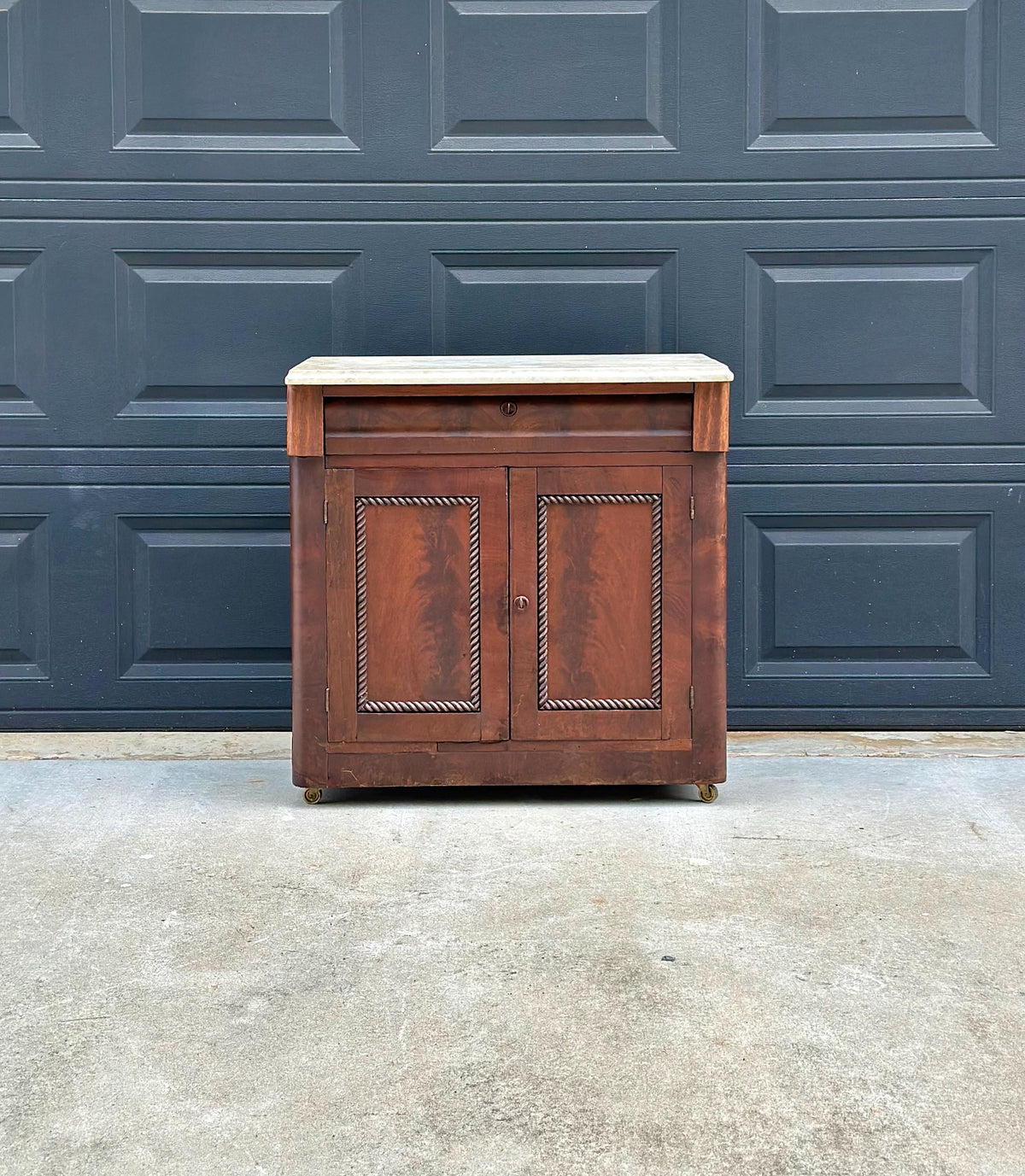 Antique Mid-19th C Marble Top Flame Mahogany Cabinet on Brass Casters (30" Wide)