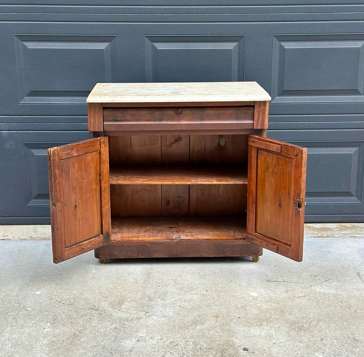 Antique Mid-19th C Marble Top Flame Mahogany Cabinet on Brass Casters (30" Wide)