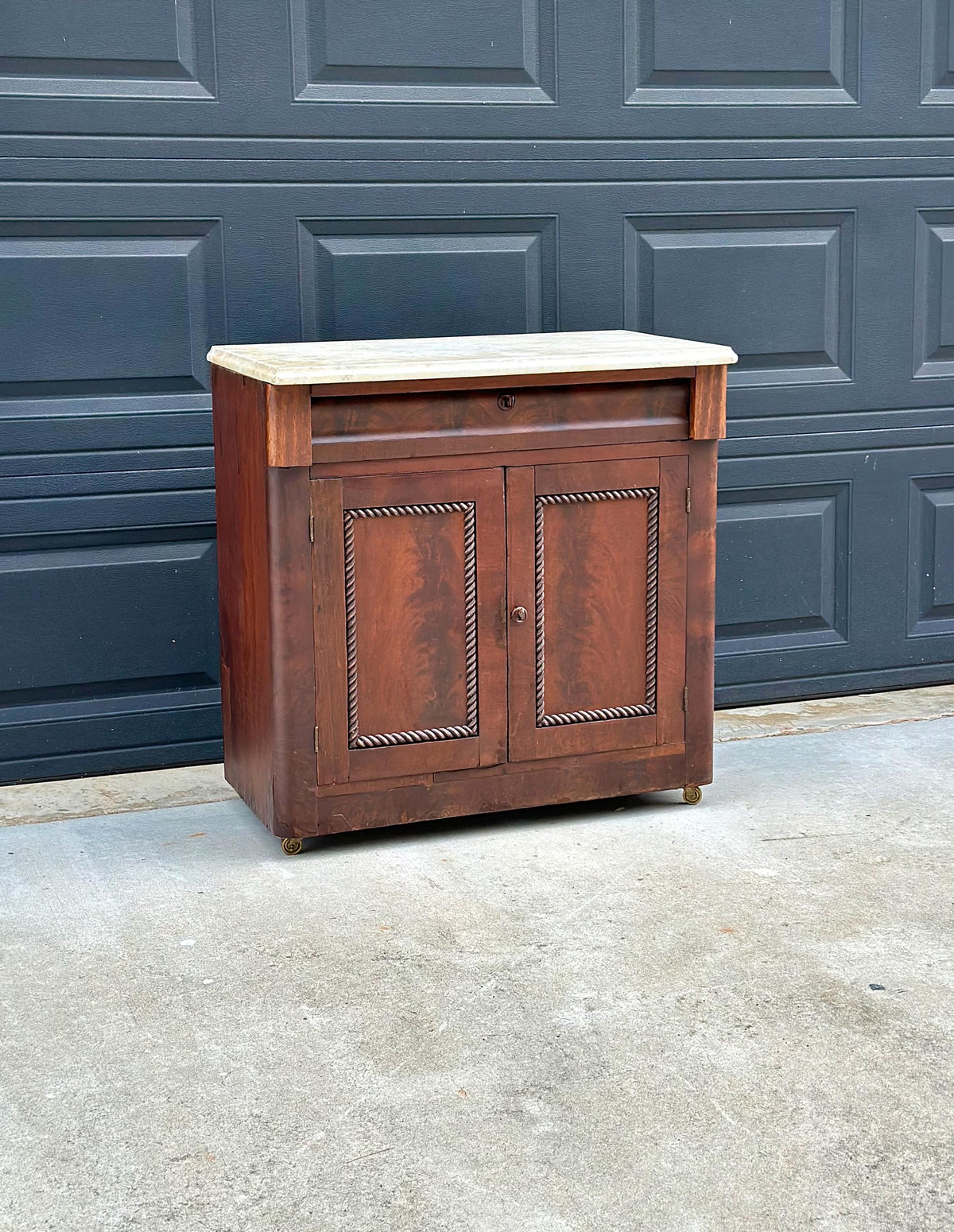 Antique Mid-19th C Marble Top Flame Mahogany Cabinet on Brass Casters (30" Wide)